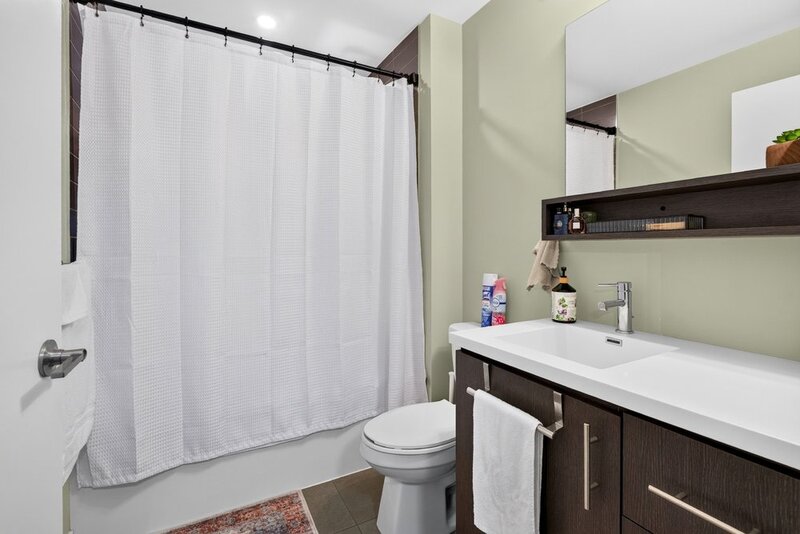 AMAZING VIEWS IN THIS GORGEOUS GRIMSBY 1BR+DEN CONDO